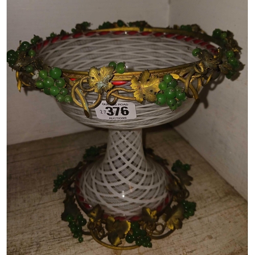 376 - GLASS CHALLIS WITH WHITE & RED DECORATION & METAL GILT TRIM TO BASE & FOOT WITH GREEN GLASS GRAPES