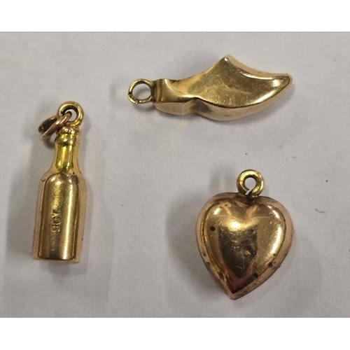 1046 - A SMALL 9ct BEER BOTTLE CHARM & 9ct CLOG CHARM & HEART