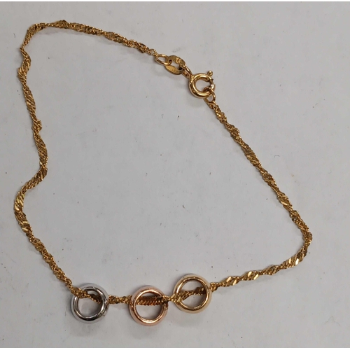 1064 - A 9CT GOLD BRACELET WITH 3 COLOURED GOLD RINGS