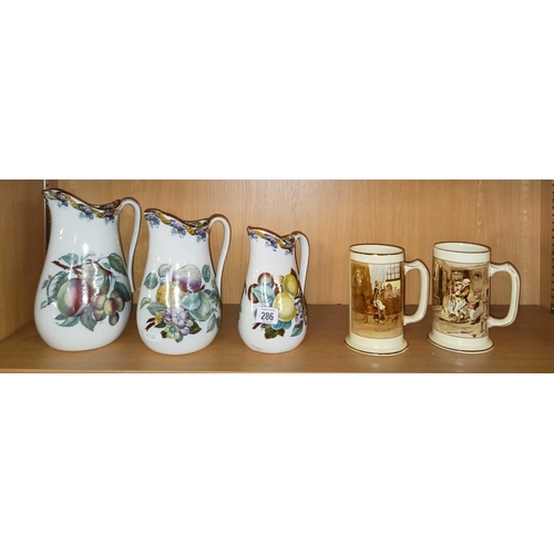 286 - 3 GRADUATED WATER JUGS A/F & 2 CHINA DRINKING STEINS