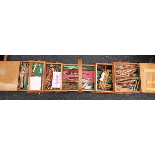 340 - CONCERTINA SEWING BOX WITH A LARGE QTY OF WOODEN BOBBINS