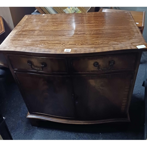 377 - FLAME VENEERED BOW FRONT CABINET WITH 2 DRAWERS