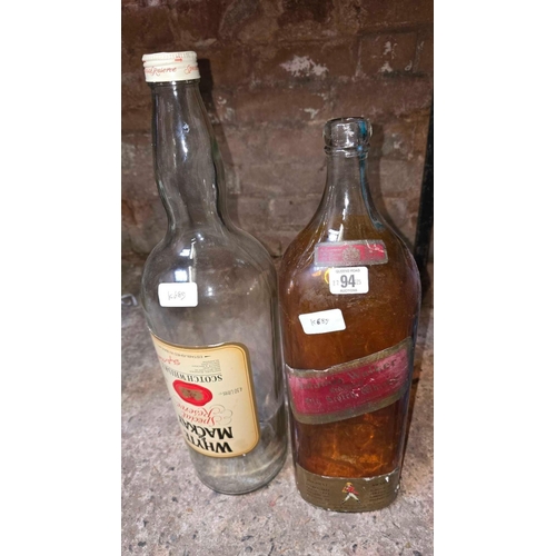 94 - 2 LARGE EMPTY GLASS WHISKY BOTTLES