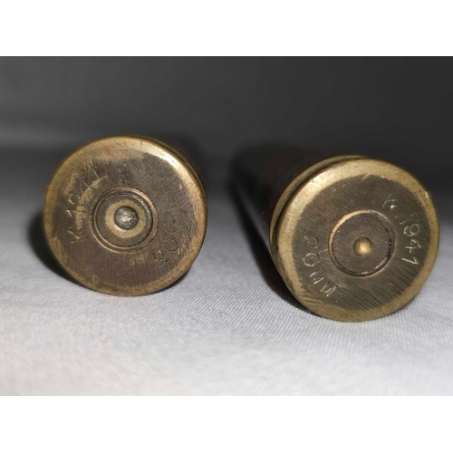 663 - 2 LARGE BULLETS & SHELL CASES