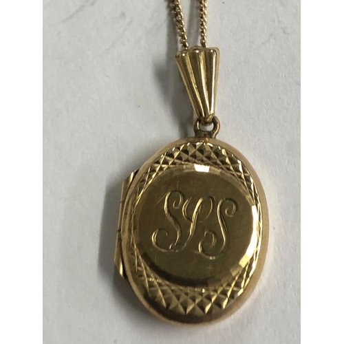 747 - AN OVAL 9ct GOLD HINGED LOCKET ON 9ct NECK CHAIN. 3.4g