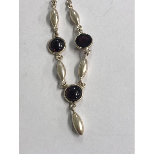 772 - A SILVER NECKLACE WITH RED STONE DROPS & ANOTHER