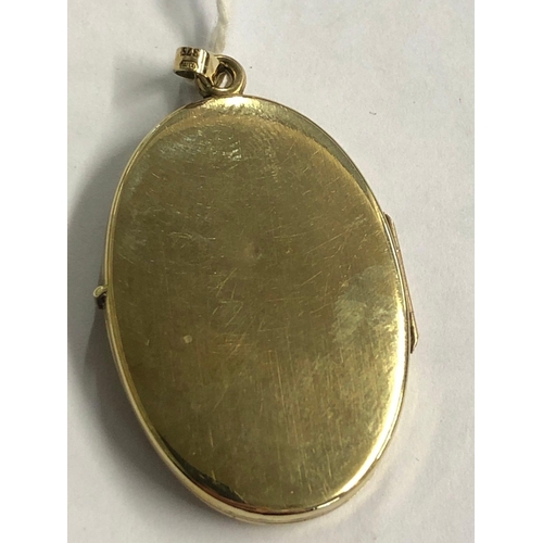 841 - AN OVAL 9ct HINGED LOCKET, 4.6g