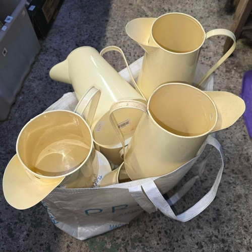 95 - 9 CREAM ENAMEL JUGS