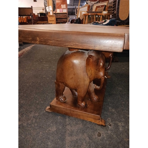 1190 - MAHOGANY COFFEE TABLE SUPPORTED BY 2 ELEPHANTS