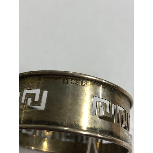 774 - A SILVER PIERCED GREEK KEY PATTERN NAPKIN RING, B'HAM 1931