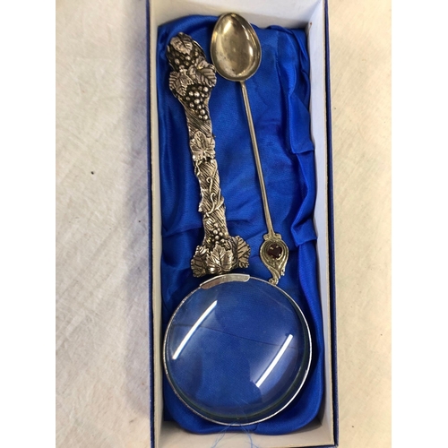 918 - BOXED SILVER SCENES MAGNIFYING GLASS & A DECORATIVE SPOON