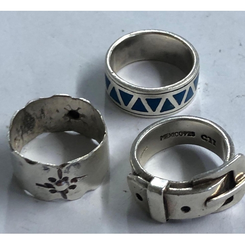 957 - 3 SILVER RINGS, 1 BUCKLE EXAMPLE PLUS FANCY SILVER BANGLE