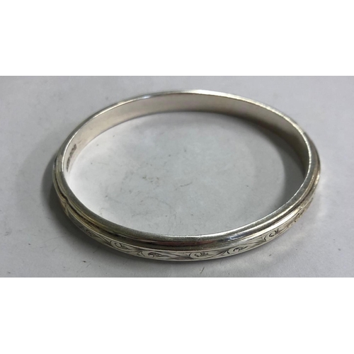 957 - 3 SILVER RINGS, 1 BUCKLE EXAMPLE PLUS FANCY SILVER BANGLE