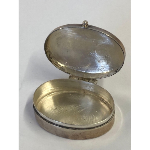 969 - AN OVAL CONTINENTAL SILVER (925 STANDARD) PILL BOX WITH BRIGHT CUT HINGED COVER