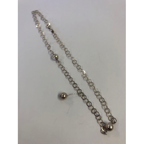 975 - A SILVER NECK CHAIN WITH BALLS, A BAT BROOCH + SILVER RING