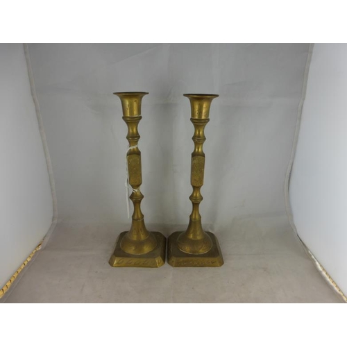 13 - Pair of oriental brass candlesticks