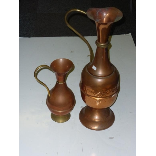 104 - Two copper and brass large jugs