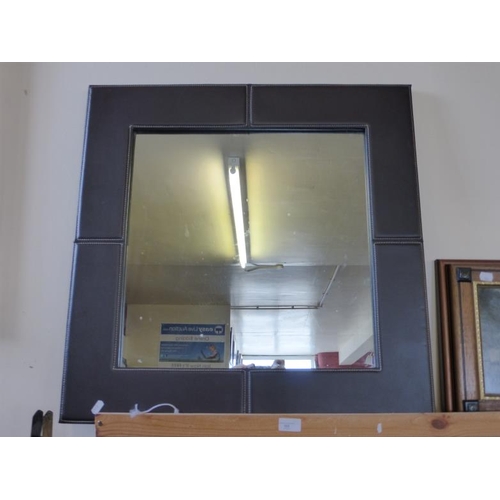 105 - Leather framed wall mirror