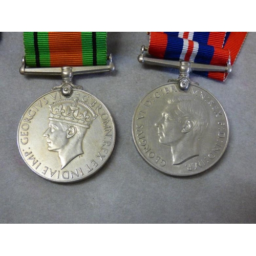 313 - Four George VI period medals including service stars