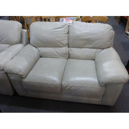 679A - Leather light coloured two seater settee