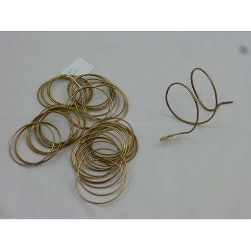 137 - Large Collection of Indian Brass Bracelets with Snake Bangle