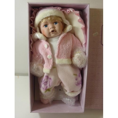 142 - Boxed NEW Leonardo porcelain baby doll