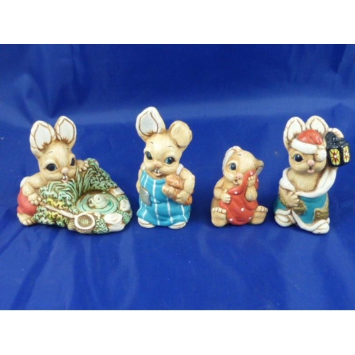 252 - Four Moorcraft Collectable rabbits