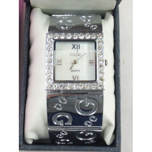 107 - Quality Selection Including Swarovski Compact, Necklace Set and Omaki Watch