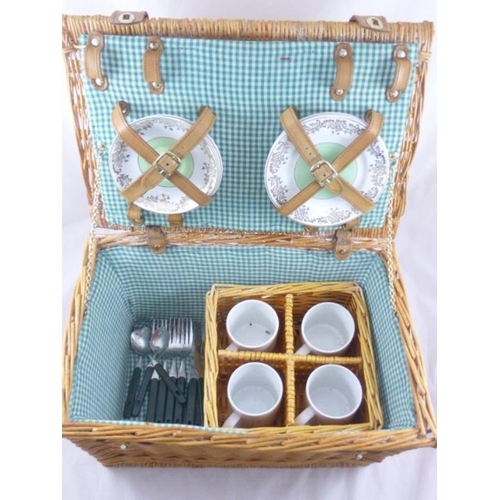 650 - Picnic set includes cups, cutlery an plates