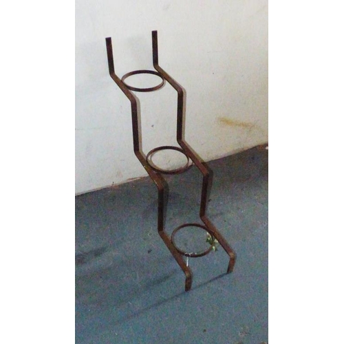 702 - Collection of five wrought iron plant holders