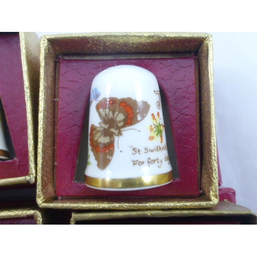 59 - Set of 12 Months of the year ceramic collectors thimbles by Caverswall. Individually boxed.