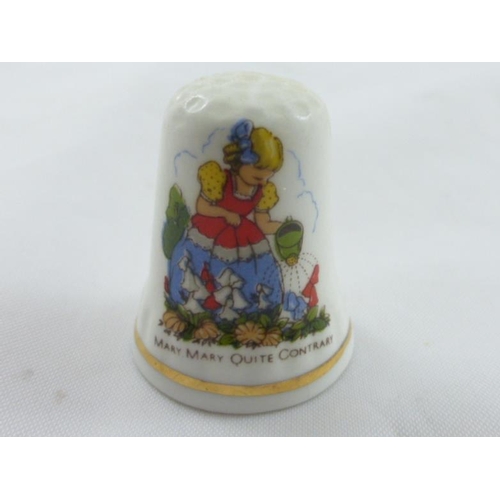 68 - A collection of 12 Nursery Rhyme Thimbles