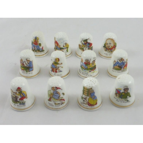 68 - A collection of 12 Nursery Rhyme Thimbles