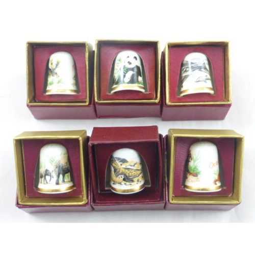 72 - Six individually boxed Caverswall collectors animal thimbles including the Giant Panda