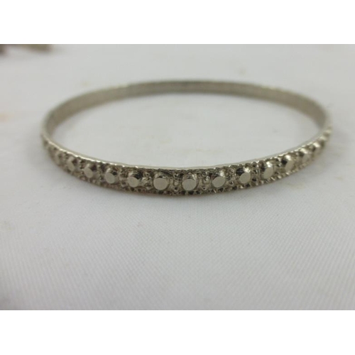 79 - Collection of 20 Decorative Silver Tone Bracelets