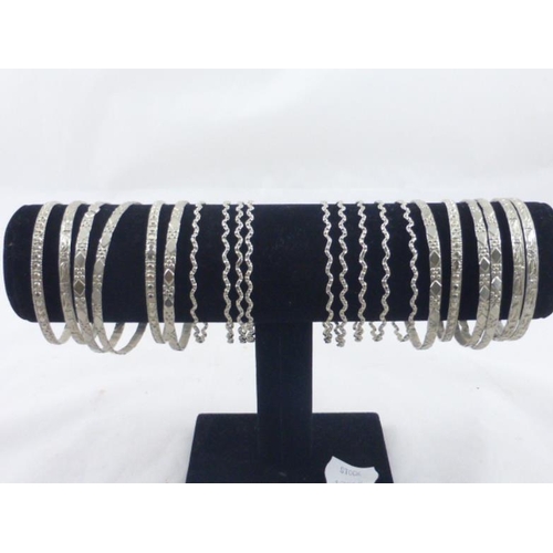 79 - Collection of 20 Decorative Silver Tone Bracelets