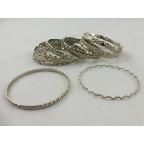 79 - Collection of 20 Decorative Silver Tone Bracelets