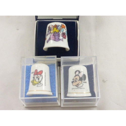 111 - Six individually boxed Disney Thimbles