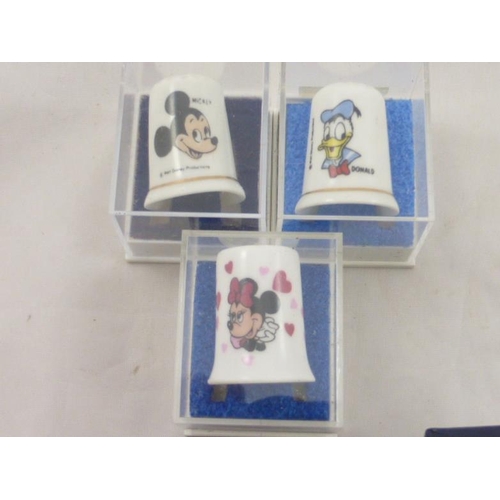 111 - Six individually boxed Disney Thimbles