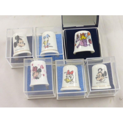 111 - Six individually boxed Disney Thimbles