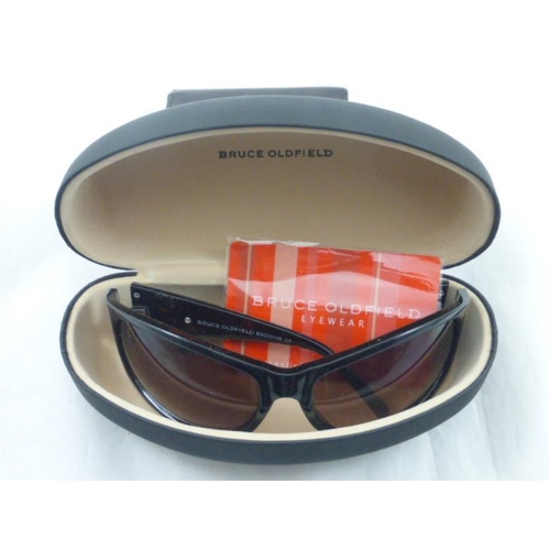 114 - Pair of Wrap Round Bruce Oldfield Sunglasses complete with Case and Certificate