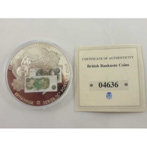 120 - A British Bank Notes commemorative coin featuring the £1 note. with cert of authenticity