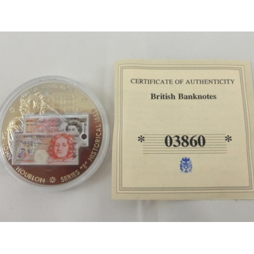 129 - A British Bank Notes commemorative coin featuring the £50 note. with cert of authenticity