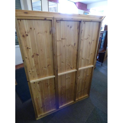 481 - A good quality solid pine triple wardrobe. 3 doors, measures 140 cm Wide, 59 cm Deep and 178 cm Tall... 