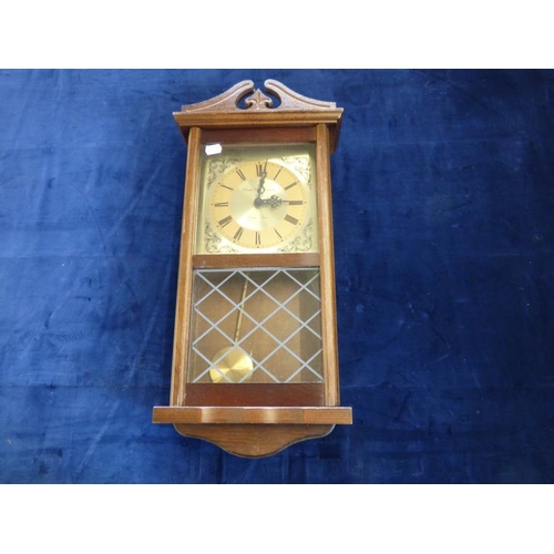 286 - Wall Mounted wood Cased Clock complete with Key and Pendulunm