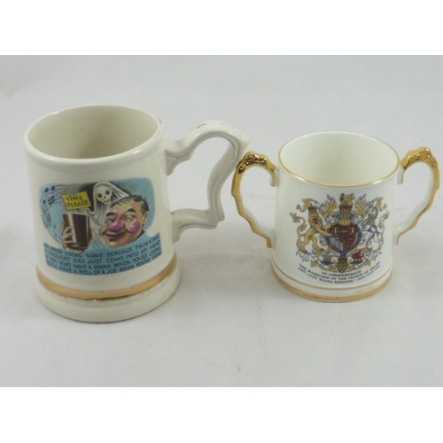 318 - Prince Willam 22 carat novelty handled cup and Charles and Diana commemorative two handled cup