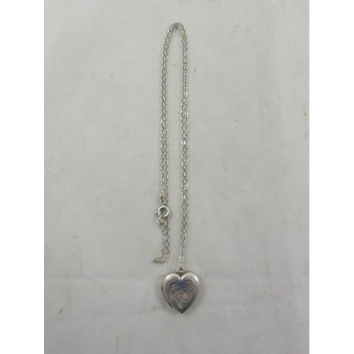 49 - Vintage Silver Heart Shaped Locket complete with Silver Chain