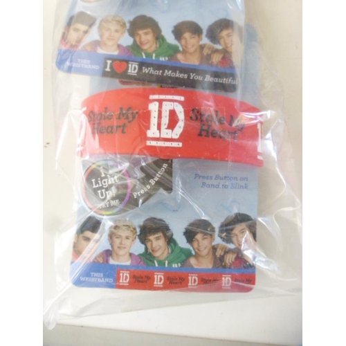 545 - Bulk Quantity of New Blinkers 1D Wrist Bands (3 Hanging Strips of 8 Bands)