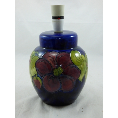 44 - ‘Clematis’, a Moorcroft ovoid lamp base, on a blue ground, impressed marks, green painted initials, ... 