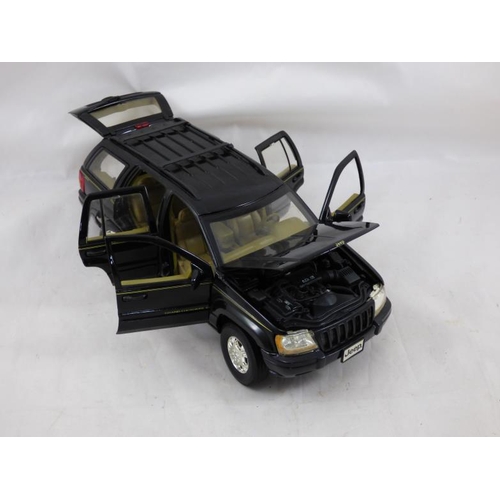 84 - Jeep Grand Cherokee (2001) Diecast Model Car is Black and features working wheels and also opening b... 